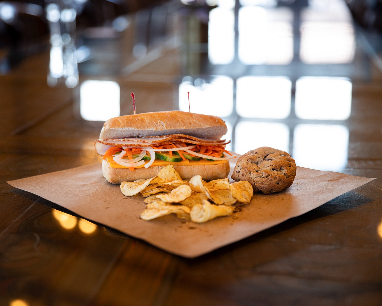 Box meal including a sandwhich, chips, and a house-made cookie